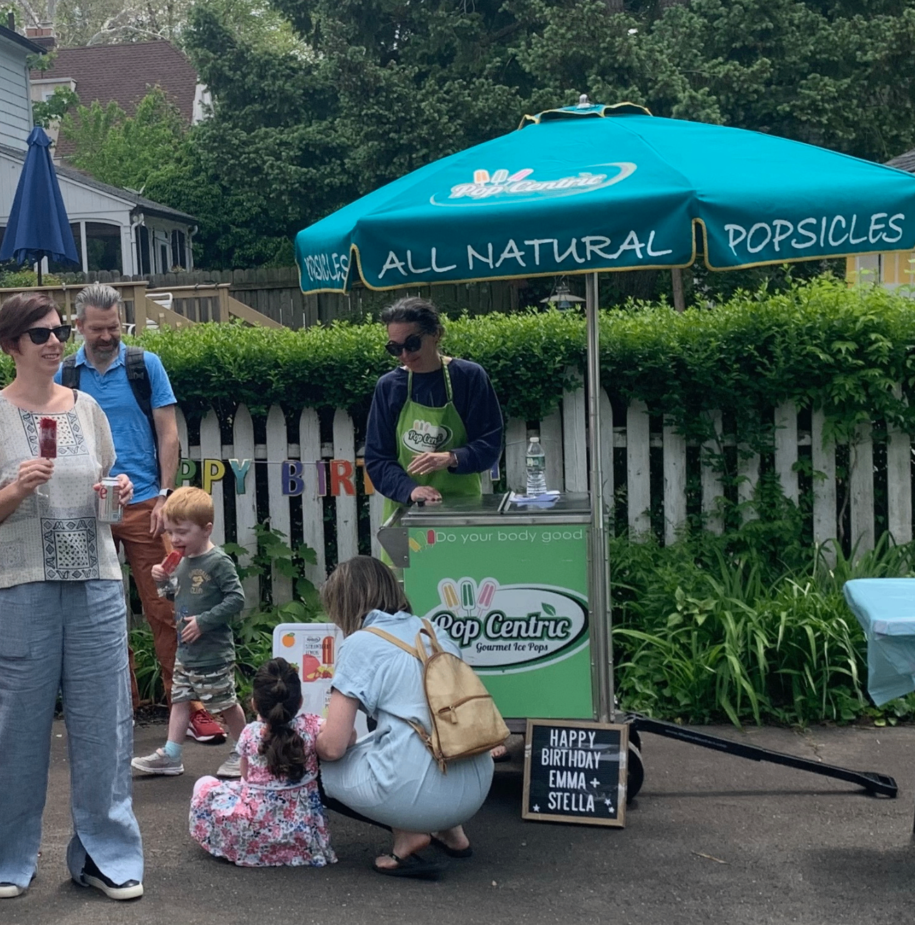 PopCentric cart at a backyard birthday party with guests gathered around