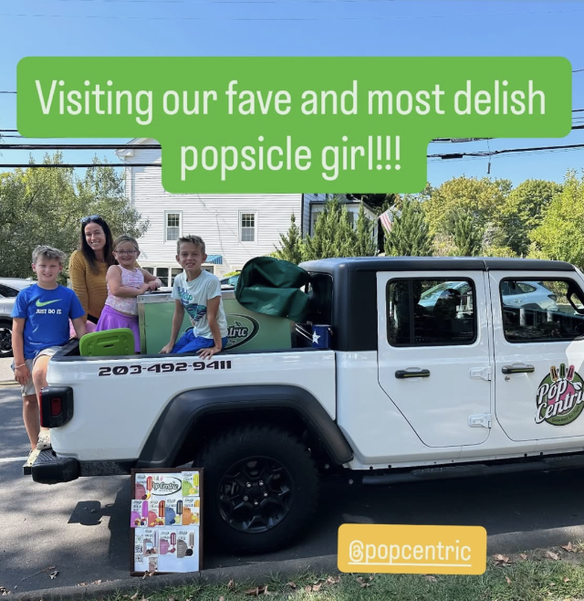 Family visiting the PopCentric truck for popsicles